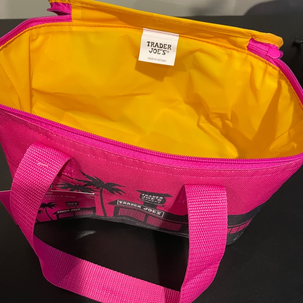 Trader Joe's Hot Pink Insulated Mini Tote bright Yellow inside. Zips closed. NWT